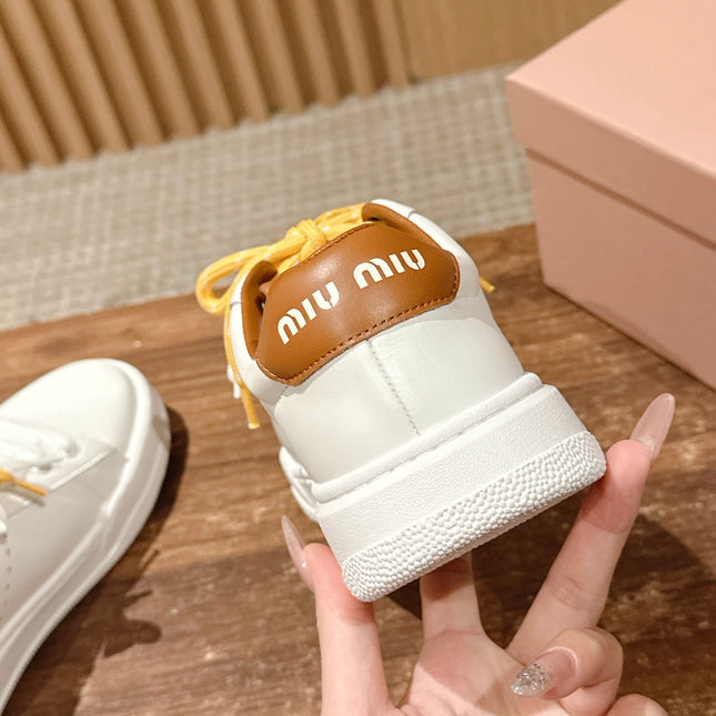 MM SNEAKERS IN WHITE CALFSKIN WITH YELLOW LACES