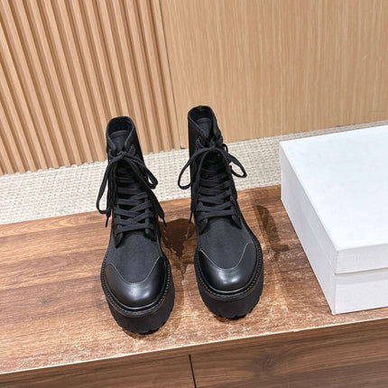 TRIOMPHE LACE-UP ANKLE BOOT IN BLACK CANVAS