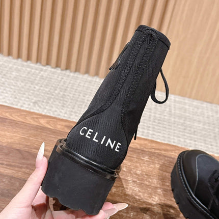 TRIOMPHE LACE-UP ANKLE BOOT IN BLACK CANVAS