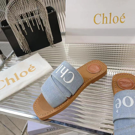 CHLOÉ WOODY MULE IN LIGHT BLUE DENIM WITH WHITE LOGO