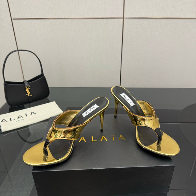 ALAIA HEELED THONG 25S IN GOLD PATENT LEATHER