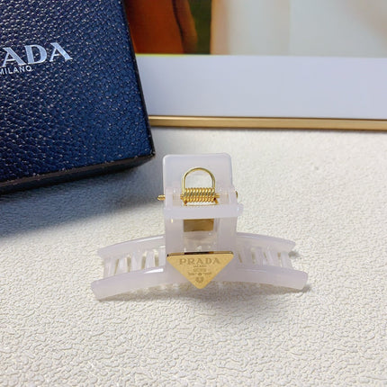 CLAW CLIP IN WHITE RESIN GOLD LOGO 201560