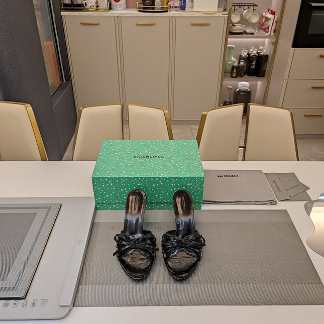 BOW-EMBELLISHED HIGH MULES IN BLACK SHEEPSKIN