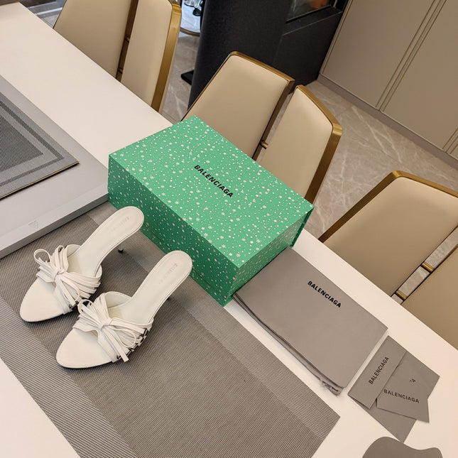 BOW-EMBELLISHED HIGH MULES IN WHITE SHEEPSKIN