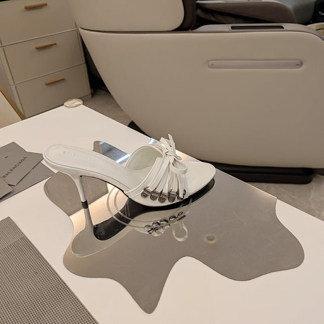 BOW-EMBELLISHED HIGH MULES IN WHITE SHEEPSKIN