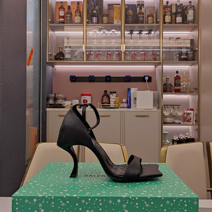 OPEN-TOE CURVED HIGH HEEL SANDALS IN BLACK SMOOTH CALFSKIN