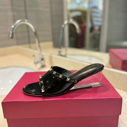 ROCKSTUD MULE SANDALS WITH TRANSPARENT HEEL IN BLACK CALFSKIN