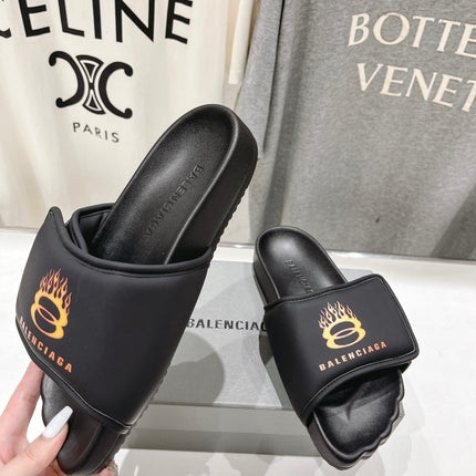 SLIDE SANDALS IN BLACK NYLON AND RUBBER YELLOW PRINT