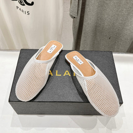 ALAIA FLAT MULES IN WHITE MESH FISHNET
