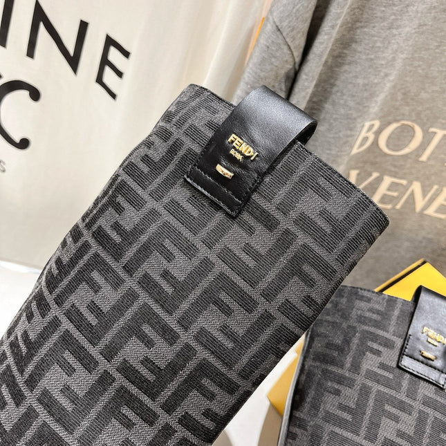 FENDI 25S HIGH BOOTS IN BLACK COWHIDE AND CANVAS LOGO EMBOSSING